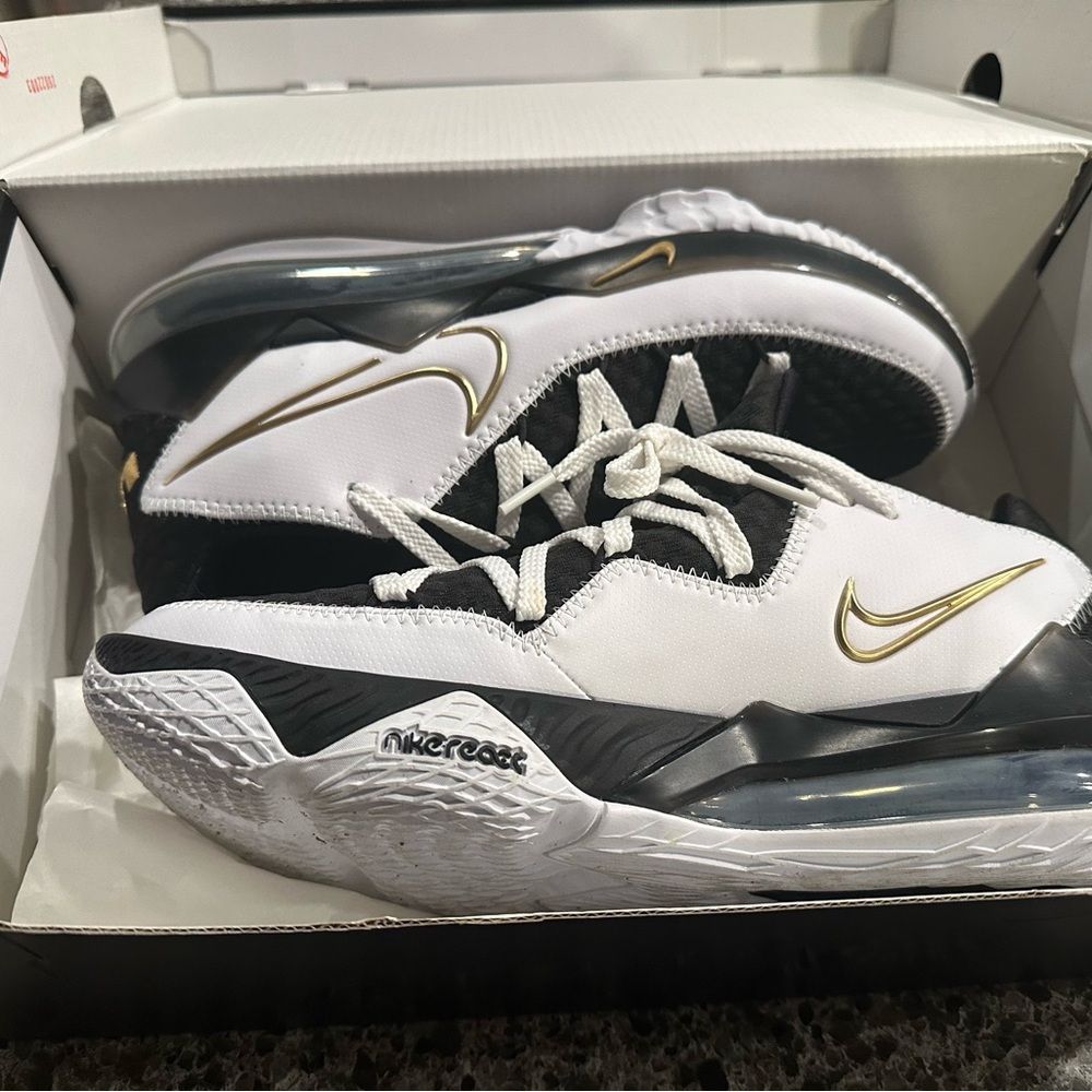 Almost New Lebrons. Tried on wore for about 10 min and put back in the box.